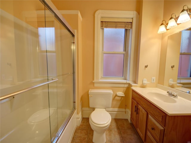 full bathroom featuring tile patterned flooring, vanity, toilet, and enclosed tub / shower combo