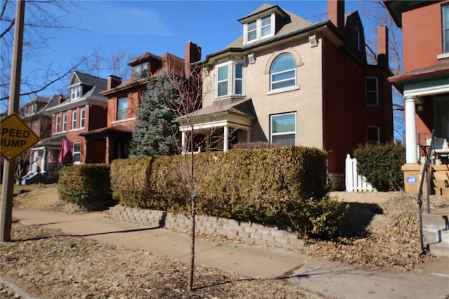 view of front of house featuring a chimney