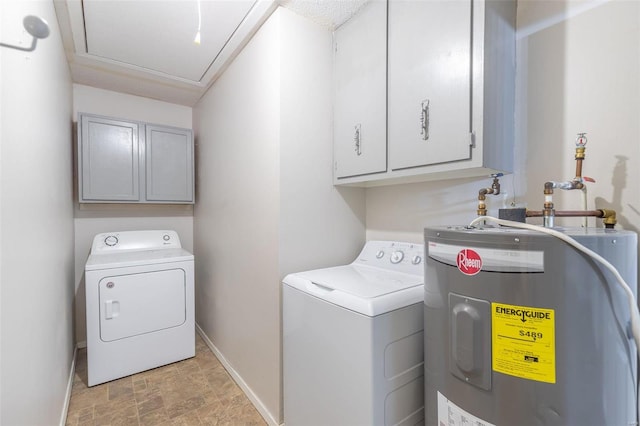 laundry area with washer and clothes dryer, cabinets, and water heater