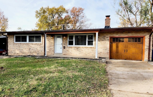 single story home with a front yard and a garage