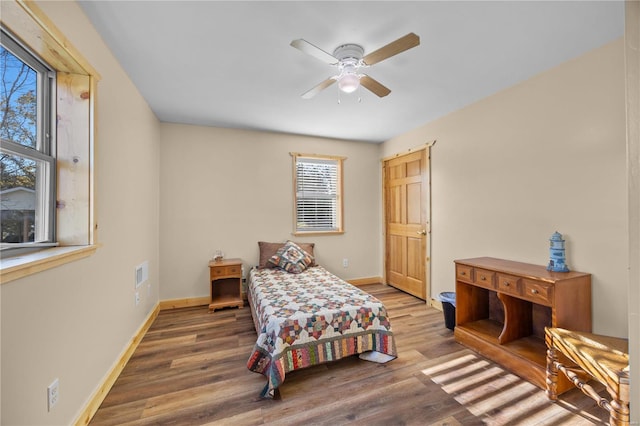 bedroom featuring hardwood / wood-style floors and ceiling fan