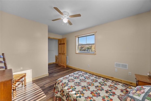 bedroom with dark wood-type flooring and ceiling fan