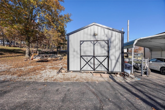 view of outbuilding featuring a carport