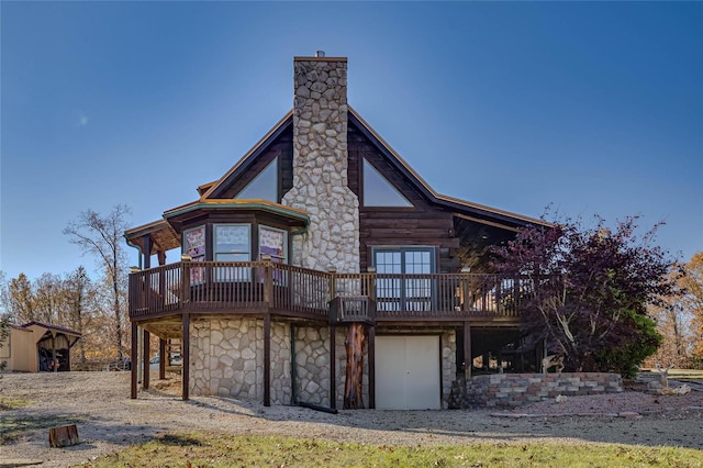 back of property with a wooden deck