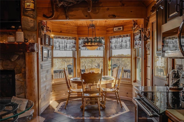 sunroom / solarium featuring wooden ceiling