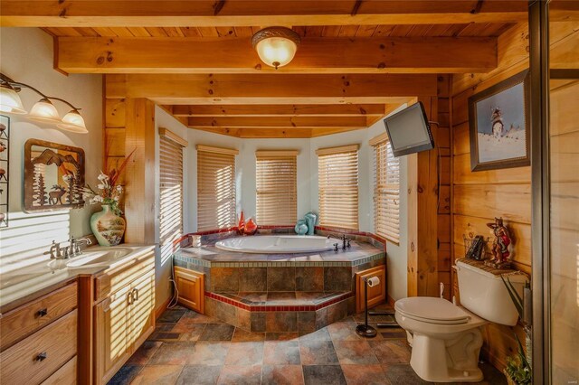 bathroom featuring vanity, toilet, wood ceiling, and tiled bath