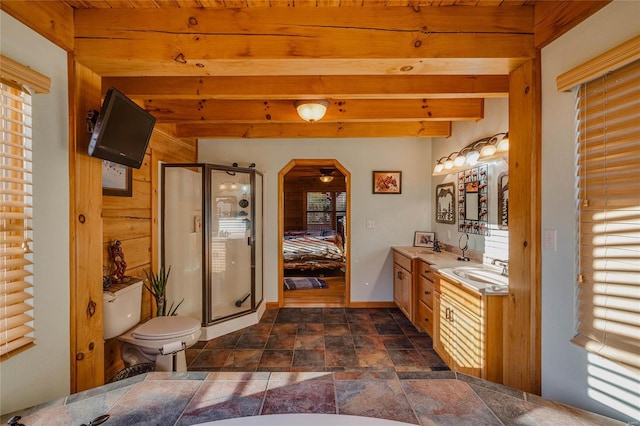 bathroom with beam ceiling, wooden ceiling, toilet, a shower with door, and vanity