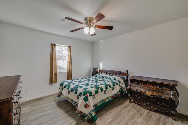 bedroom featuring ceiling fan and light hardwood / wood-style floors