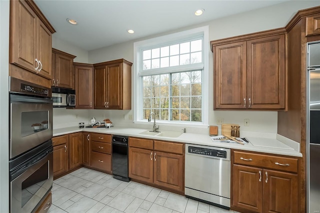 kitchen with sink and appliances with stainless steel finishes