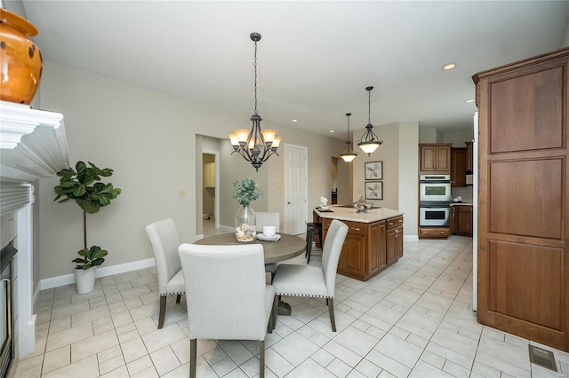 dining space with a notable chandelier