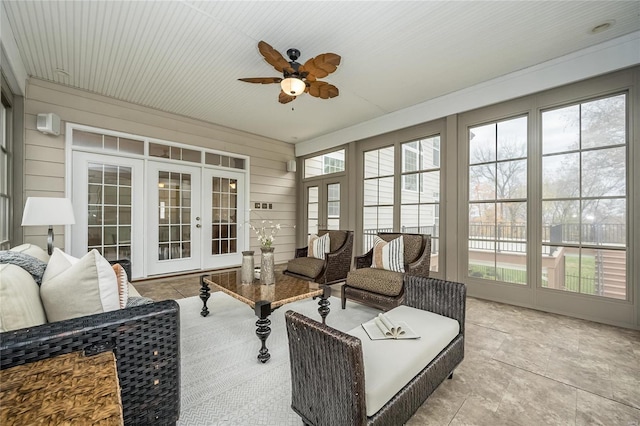 sunroom with french doors, ceiling fan, and a healthy amount of sunlight