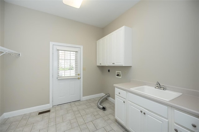 laundry room featuring cabinets, sink, hookup for a washing machine, light tile patterned floors, and hookup for an electric dryer