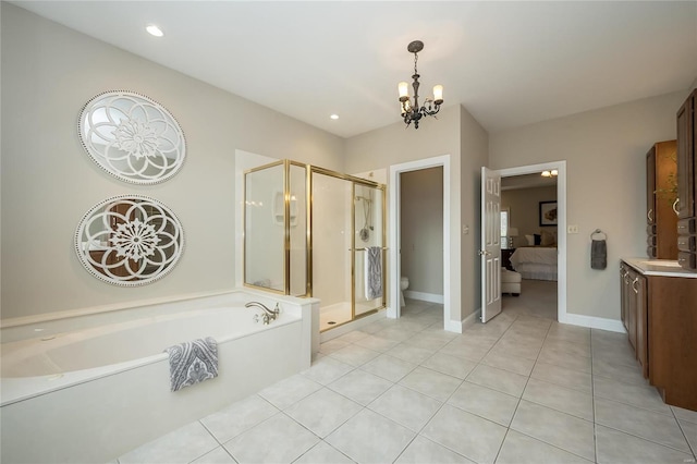 full bathroom featuring tile patterned floors, vanity, separate shower and tub, a chandelier, and toilet