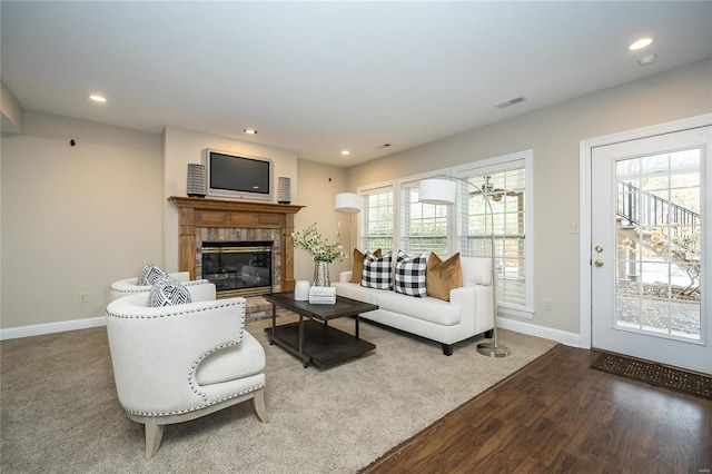 living room with plenty of natural light and hardwood / wood-style floors