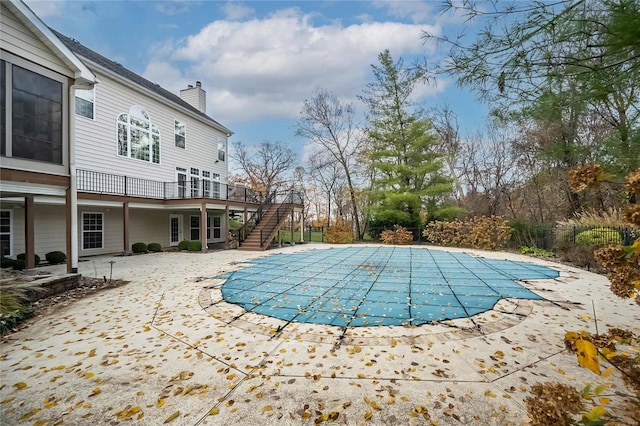 view of swimming pool featuring a patio area