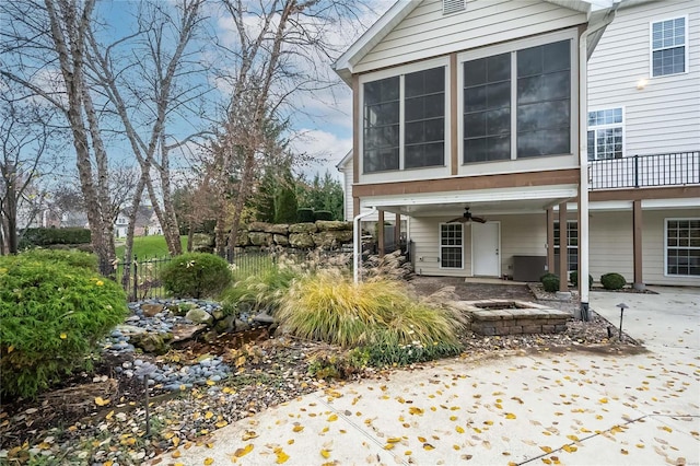 back of property with a patio and ceiling fan