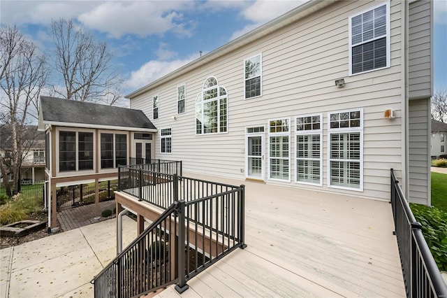 wooden terrace with a sunroom