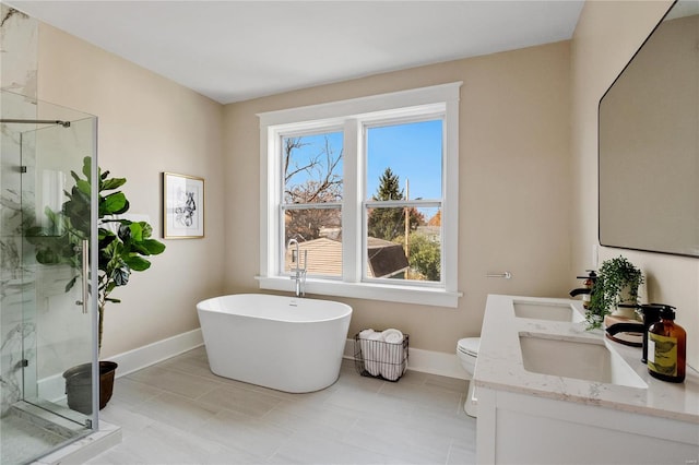 full bathroom featuring vanity, shower with separate bathtub, and toilet