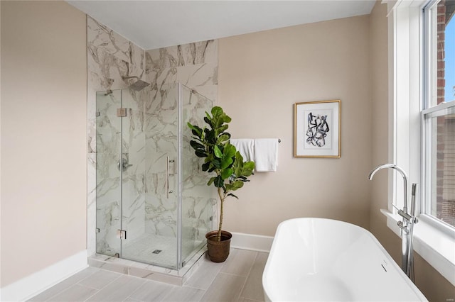 bathroom featuring separate shower and tub