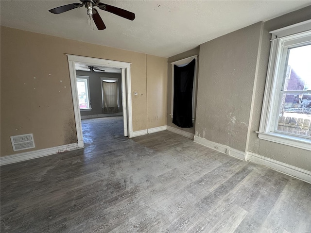 unfurnished room with wood-type flooring