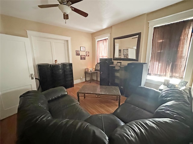 living room with hardwood / wood-style floors and ceiling fan