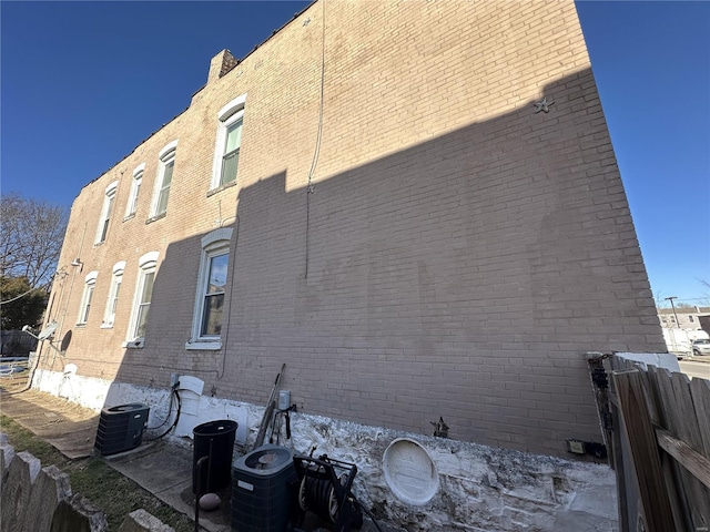 view of side of property featuring central air condition unit