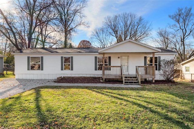 view of front of house with a porch and a front yard