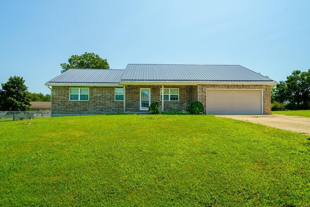 ranch-style home with a garage and a front lawn