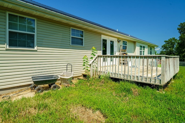 rear view of property with a wooden deck