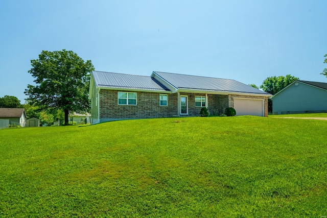 ranch-style house with a front yard and a garage