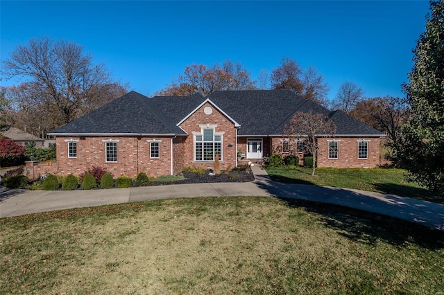 ranch-style home featuring a front lawn