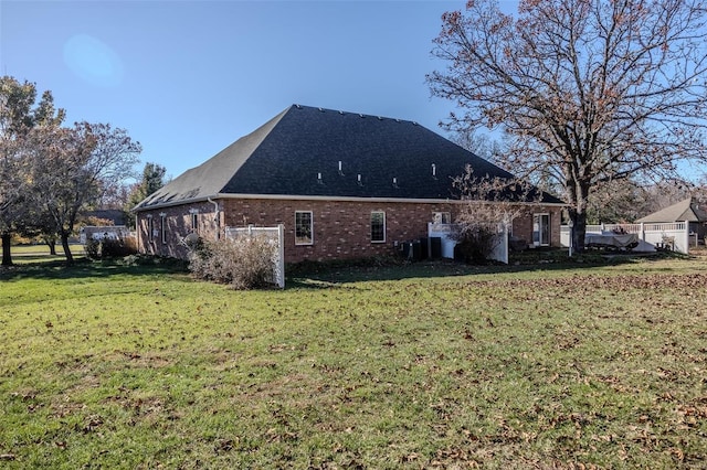 view of home's exterior with a yard