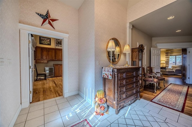 hallway with light hardwood / wood-style floors