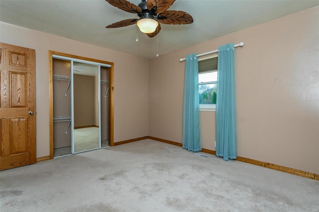 unfurnished bedroom with light carpet and ceiling fan