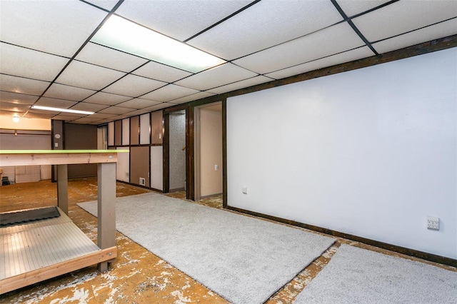 basement featuring a drop ceiling