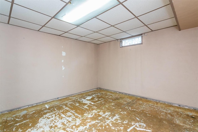 basement featuring a drop ceiling