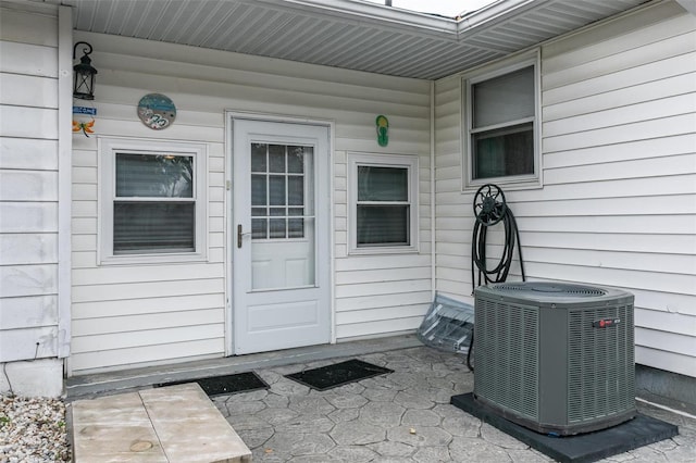 property entrance with central AC unit