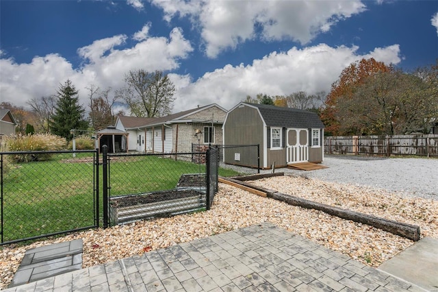 ranch-style home with a front yard and a storage shed