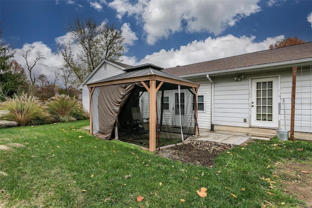 view of outdoor structure featuring a gazebo and a yard