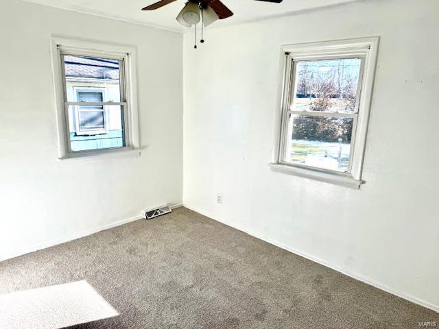 carpeted empty room with ceiling fan