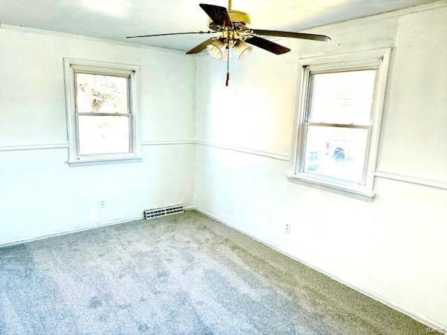 unfurnished room with ceiling fan and light colored carpet