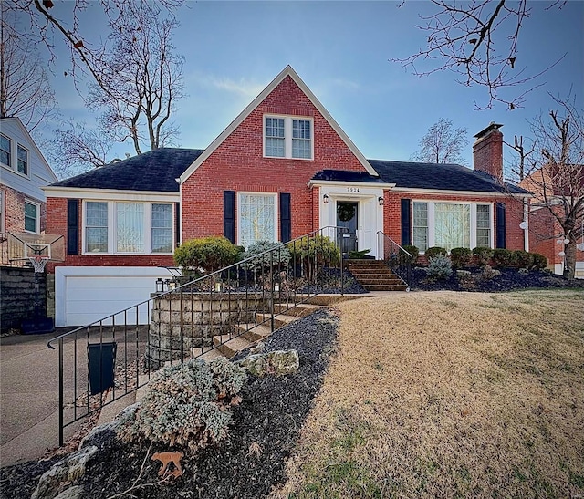 view of front of house with a front yard and a garage