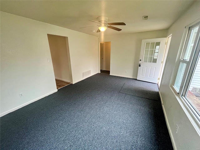 unfurnished room with ceiling fan