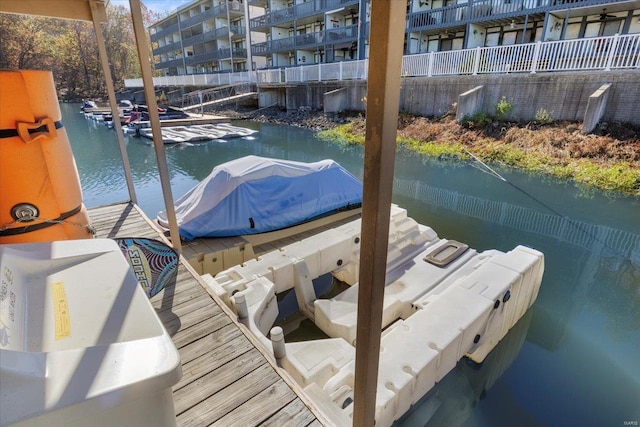 view of dock with a water view