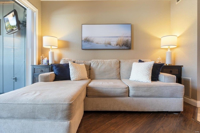 living room with dark hardwood / wood-style flooring