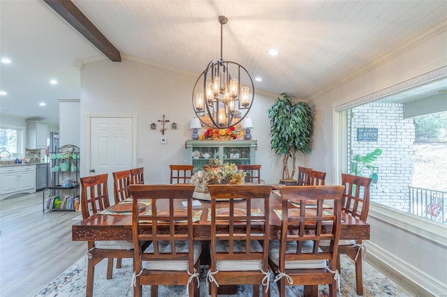 dining area with light hardwood / wood-style flooring, lofted ceiling with beams, crown molding, a chandelier, and wood ceiling