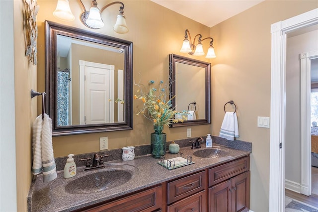 bathroom with vanity and wood-type flooring