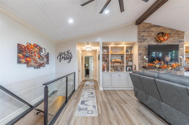 living room featuring ceiling fan, built in features, lofted ceiling with beams, light hardwood / wood-style floors, and wood ceiling