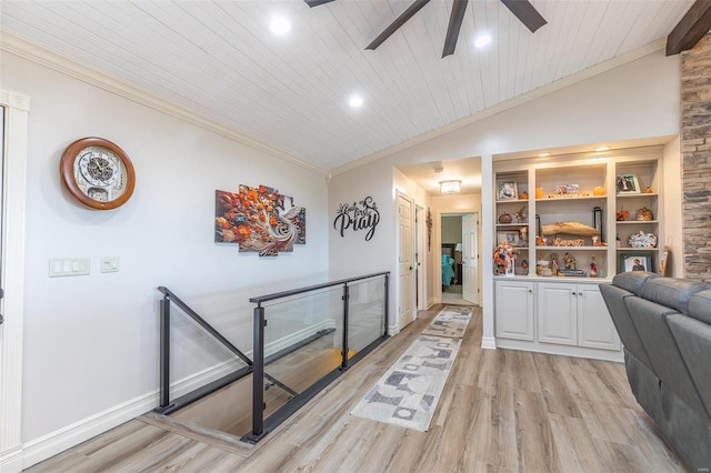 corridor featuring light hardwood / wood-style flooring, vaulted ceiling, wooden ceiling, and crown molding