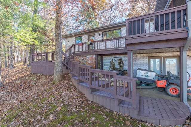 rear view of property featuring a deck